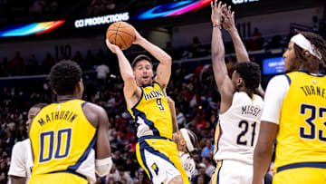 Nov 1, 2024; New Orleans, Louisiana, USA;  Indiana Pacers guard T.J. McConnell (9) passes the ball to Indiana Pacers guard Bennedict Mathurin (00) against New Orleans Pelicans forward Zion Williamson (1) during the second half at Smoothie King Center. Mandatory Credit: Stephen Lew-Imagn Images