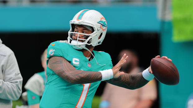 Dec 22, 2024; Miami Gardens, Florida, USA; Miami Dolphins quarterback Tua Tagovailoa (1) throws the football before the game 