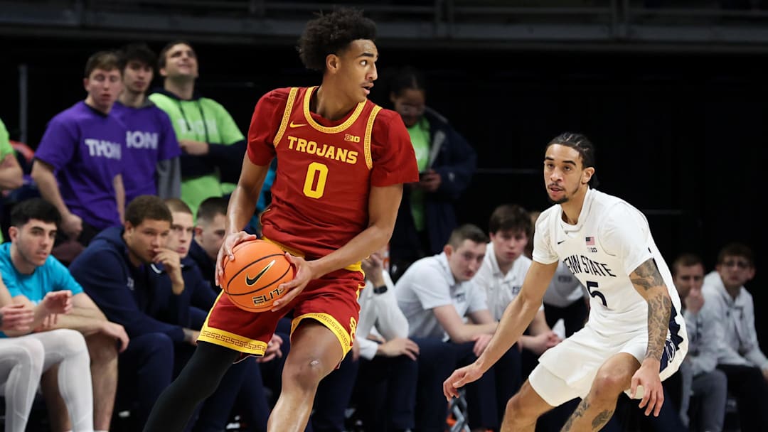 Feb 8, 2026; University Park, Pennsylvania, USA; Southern California Trojans guard Alijah Arenas (0) moves with the ball as Penn State Nittany Lions guard Freddie Dilione V (5) defends during the first half at Bryce Jordan Center. Mandatory Credit: Matthew O'Haren-Imagn Images