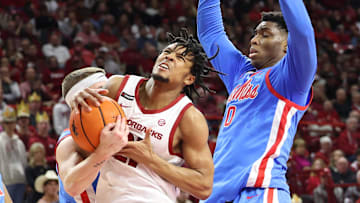 Arkansas Razorbacks guard D.J. Wagner (21) drives against Ole Miss Rebels forward Malik Dia (0) during the second half at Bud Walton Arena. Ole Miss won 73-66. 