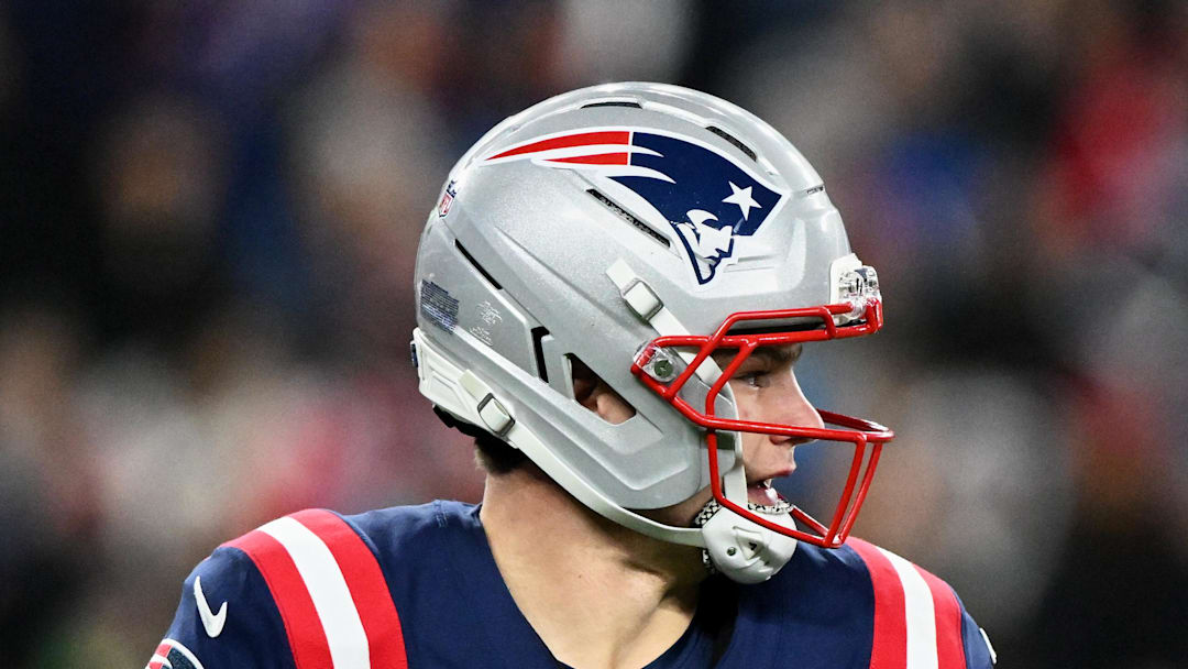 New England Patriots quarterback Drake Maye scrambles against the Miami Dolphins.