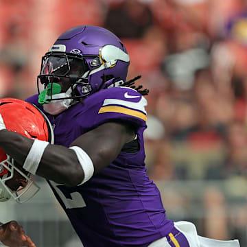 Cleveland Browns quarterback Dorian Thompson-Robinson is sacked by Minnesota Vikings linebacker Brian Asamoah II.