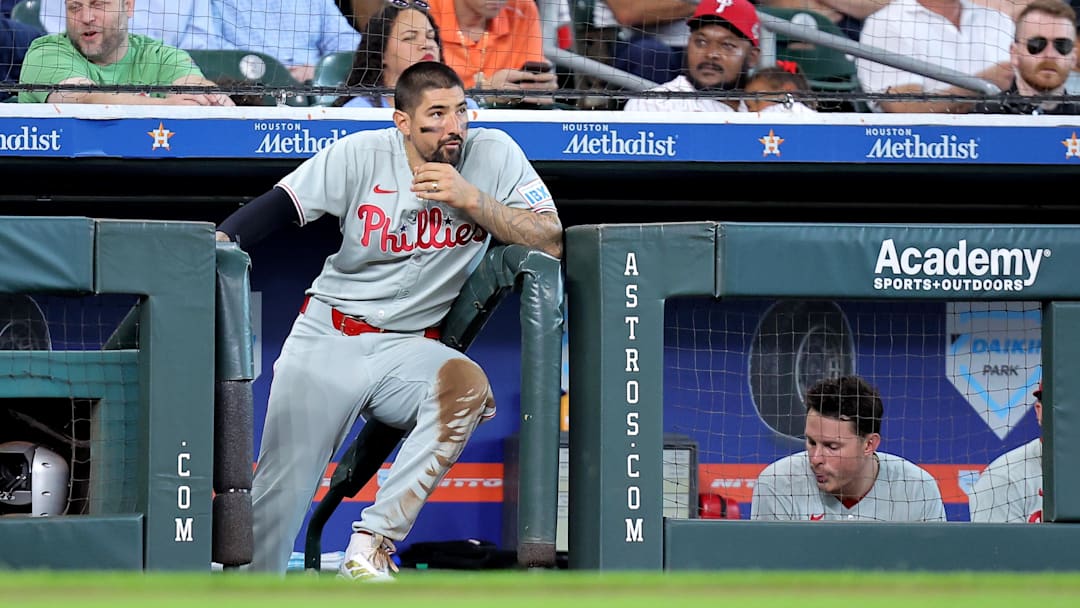 Jun 26, 2025; Houston, Texas, USA; Philadelphia Phillies right fielder Nick Castellanos (8) watches the action from the dugout against the Houston Astros during the third inning at Daikin Park.