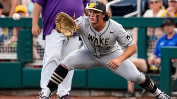 Jun 21, 2023; Omaha, NE, USA; Wake Forest Demon Deacons first baseman Nick Kurtz (8) gets an out during the first inning against the LSU Tigers at Charles Schwab Field Omaha. Mandatory Credit: Dylan Widger-USA TODAY Sports