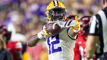 Nov 22, 2025; Baton Rouge, Louisiana, USA;  LSU Tigers wide receiver Kyle Parker (12) reacts to making a first down against Western Kentucky Hilltoppers defensive back Nazir Ward (not pictured) during the first half at Tiger Stadium. Mandatory Credit: Stephen Lew-Imagn Images
