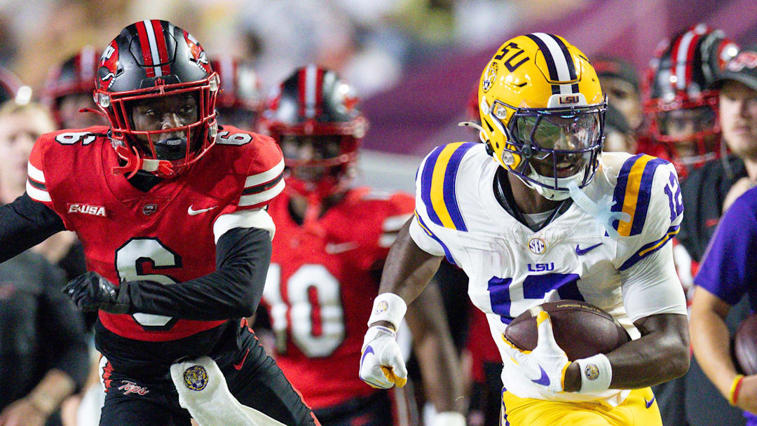 Nov 22, 2025; Baton Rouge, Louisiana, USA;  LSU Tigers wide receiver Kyle Parker (12) runs against Western Kentucky Hilltoppers defensive back Nazir Ward (6) during the first half at Tiger Stadium. Mandatory Credit: Stephen Lew-Imagn Images