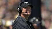 Purdue Boilermakers head coach Barry Odom looks up at the video board