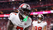 Tampa Bay Buccaneers running back Bucky Irving (7) celebrates after scoring a touchdown against the Atlanta Falcons 