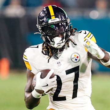Aug 9, 2025; Jacksonville, Florida, USA; Pittsburgh Steelers running back Trey Sermon (27) carries the ball against the Jacksonville Jaguars during a preseason game at EverBank Stadium. Mandatory Credit: Travis Register-Imagn Images