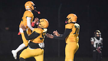Ramel Hernandez of Melbourne Central Catholic celebrates his touchdown against Trinity Catholic with teammates Jayden Jordan and Javeion Cooper in the FHSAA Region 2-1S football finals November 24, 2023. Craig Bailey/FLORIDA TODAY via USA TODAY NETWORK