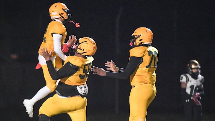 Ramel Hernandez of Melbourne Central Catholic celebrates his touchdown against Trinity Catholic with teammates Jayden Jordan and Javeion Cooper in the FHSAA Region 2-1S football finals November 24, 2023. Craig Bailey/FLORIDA TODAY via USA TODAY NETWORK
