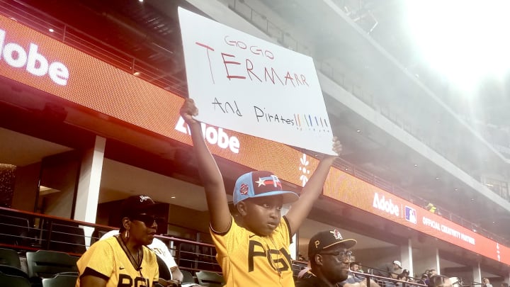 Grant Ashley, cousin of Termarr Johnson, holds up a sign of support at the MLB Futures All-Star Game in Texas in 2024.