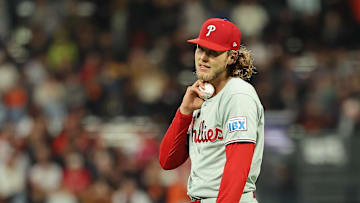Jul 8, 2025; San Francisco, California, USA; Philadelphia Phillies third baseman Alec Bohm (28) checks his pulse after bobbling the ball against the San Francisco Giants during the ninth inning at Oracle Park. Mandatory Credit: Kelley L Cox-Imagn Images