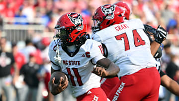 Sep 20, 2025; Durham, North Carolina, USA;  North Carolina State Wolfpack quarter back CJ Bailey (11) runs the ball against the Duke Blue Devils during the first quarter at Wallace Wade Stadium. Mandatory Credit: Zachary Taft-Imagn Images