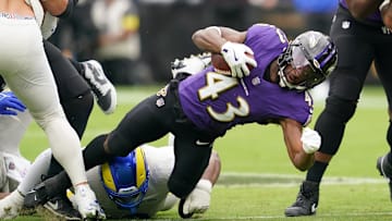 Oct 12, 2025; Baltimore, Maryland, USA; Baltimore Ravens running back Justice Hill (43) carries the ball against the Los Angeles Rams during the first quarter of the game at M&T Bank Stadium. Mandatory Credit: Mitch Stringer-Imagn Images