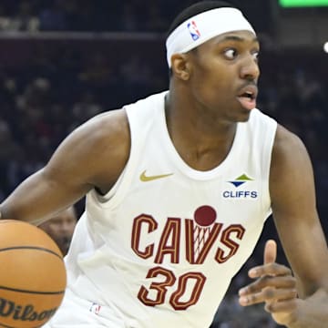 Apr 13, 2025; Cleveland, Ohio, USA; Cleveland Cavaliers forward Nae'Qwan Tomlin (30) dribbles in the first quarter against the Indiana Pacers at Rocket Arena. Mandatory Credit: David Richard-Imagn Images