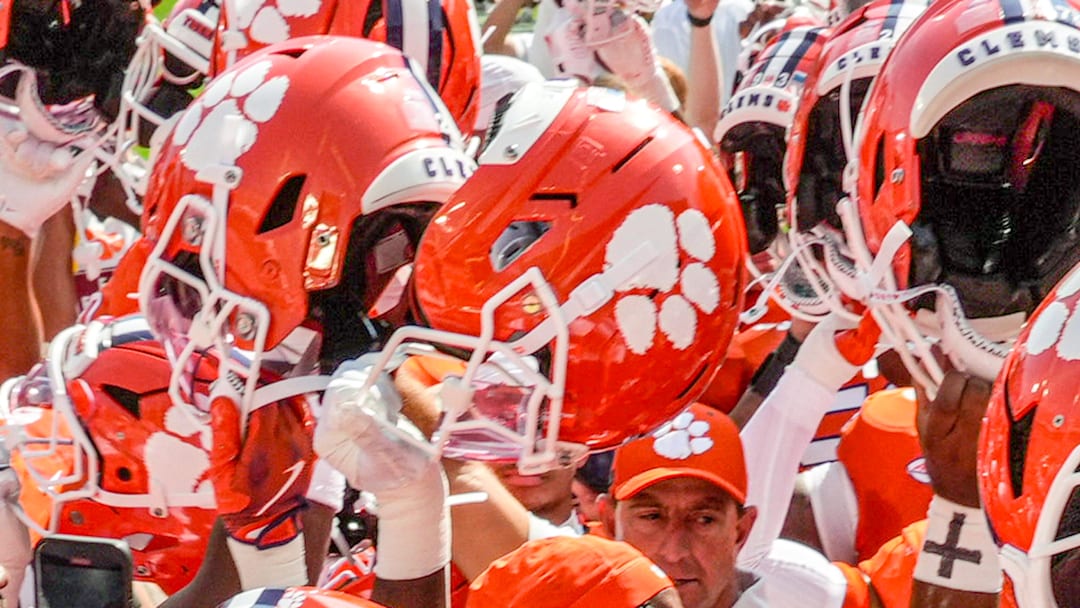 Sep 20, 2025; Clemson, South Carolina, USA; Clemson Tigers head coach Dabo Swinney in a huddle with players during pregame practice before their game against the Syracuse Orange in Memorial Stadium. Mandatory Credit: Ken  Ruinard/GREENVILLE NEWS-USA TODAY Network via Imagn Images