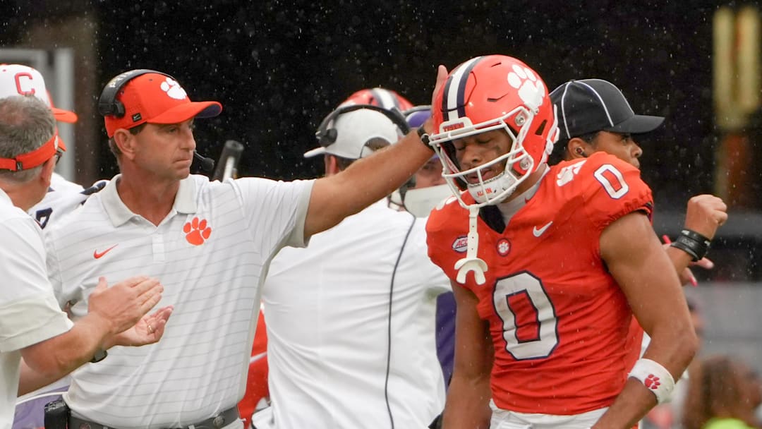 Sep 20, 2025; Clemson, South Carolina, USA; Clemson Tigers head coach Dabo Swinney reacts with wide receiver Antonio Williams (0) after the offense did not get a first down against the Syracuse Orange in the fourth quarter at Memorial Stadium. Mandatory Credit: Ken Ruinard/GREENVILLE NEWS-USA TODAY Network via Imagn Images