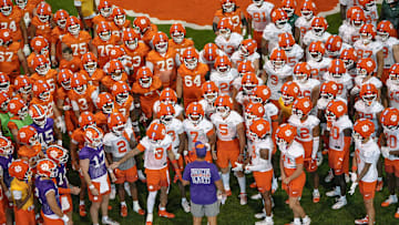 Clemson head coach Dabo Swinney talks with players before going outside for practice at the Allen N. Reeves Football Complex in Clemson, S.C. Friday, August 1, 2025.