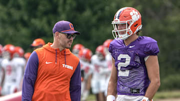 Clemson offensive coordinator Garrett Riley and quarterback Cade Klubnik (2) talk during Clemson football 2025 practice at Jervey Meadows in Clemson, S.C. Wednesday, August 6, 2025.