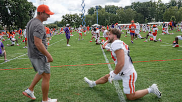 Clemson head coach Dabo Swinney talks with safety Tyler Venables (24) during Clemson football 2025 practice at Jervey Meadows in Clemson, S.C. Wednesday, August 6, 2025.