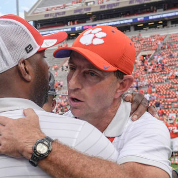 Sep 20, 2025; Clemson, South Carolina, USA; Clemson Tigers head coach Dabo Swinney congratulates Syracuse Orange head coach Fran Brown after their game at Memorial Stadium. Mandatory Credit: Ken Ruinard/GREENVILLE NEWS-USA TODAY Network via Imagn Images
