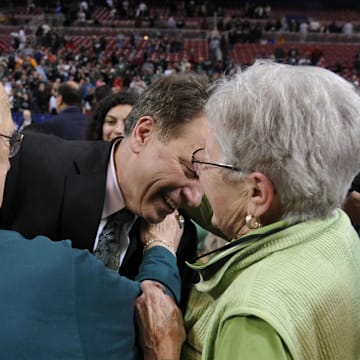 Michigan State Spartans head coach Tom Izzo is greeted by his mother and father. (2010).