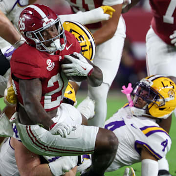 Nov 8, 2025; Tuscaloosa, Alabama, USA; Alabama Crimson Tide running back Jamarion Miller (26) is tackles by Louisiana State Tigers during the first quarter of the game at Saban Field at Bryant-Denny Stadium. Mandatory Credit: David Leong-Imagn Images