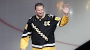 Feb 18, 2024; Pittsburgh, Pennsylvania, USA;  Pittsburgh Penguins former center Mario Lemieux waves to the crowd during a ceremony to retire the jersey number of Penguins former right wing Jaromir Jagr (not pictured) at PPG Paints Arena. The Penguins hosted the Los Angeles Kings after the ceremony. Los Angeles won 2-1. Mandatory Credit: Charles LeClaire-Imagn Images
