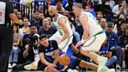 Apr 27, 2025; Orlando, Florida, USA; Orlando Magic guard Anthony Black (0) and Boston Celtics guard Payton Pritchard (11) scramble for a loose ball in the second quarter during game four of first round for the 2025 NBA Playoffs at Kia Center. Mandatory Credit: Nathan Ray Seebeck-Imagn Images