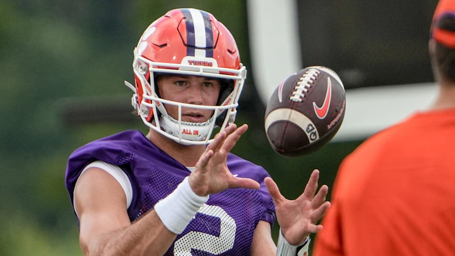 Clemson quarterback Cade Klubnik (2) catches the football during Clemson football practice.