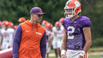 Clemson offensive coordinator Garrett Riley and quarterback Cade Klubnik (2) talk during Clemson football 2025 practice at Jervey Meadows in Clemson, S.C. Wednesday, August 6, 2025.