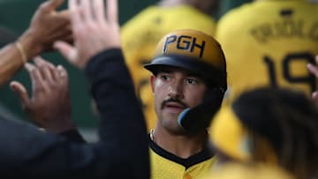 Sep 5, 2025; Pittsburgh, Pennsylvania, USA;  Pittsburgh Pirates second baseman Nick Gonzales (39) celebrates in the dugout after scoring a run against the Milwaukee Brewers during the second inning at PNC Park. Mandatory Credit: Charles LeClaire-Imagn Images