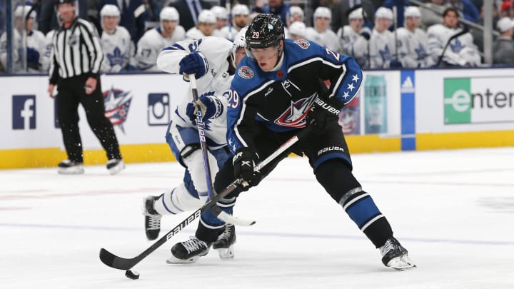 Feb 10, 2023; Columbus, Ohio, USA; Columbus Blue Jackets right wing Patrik Laine (29) controls the puck as Toronto Maple Leafs center Alexander Kerfoot (15) trails the play during the second period at Nationwide Arena. Mandatory Credit: Russell LaBounty-USA TODAY Sports