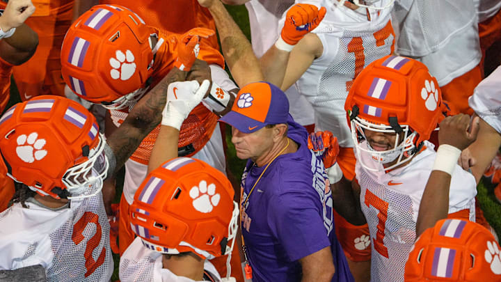 Clemson head coach Dabo Swinney talks with players before going outside for practice at the Allen N. Reeves Football Complex in Clemson, S.C. Friday, August 1, 2025.