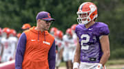 Clemson offensive coordinator Garrett Riley and quarterback Cade Klubnik (2) talk during Clemson football 2025 practice at Jervey Meadows in Clemson, S.C. Wednesday, August 6, 2025.