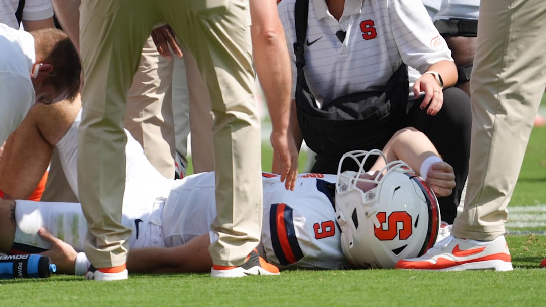 Sep 20, 2025; Clemson, South Carolina, USA; Syracuse Orange quarterback Steve Angeli (9) is checked out after being knocked down by the Clemson Tigers.