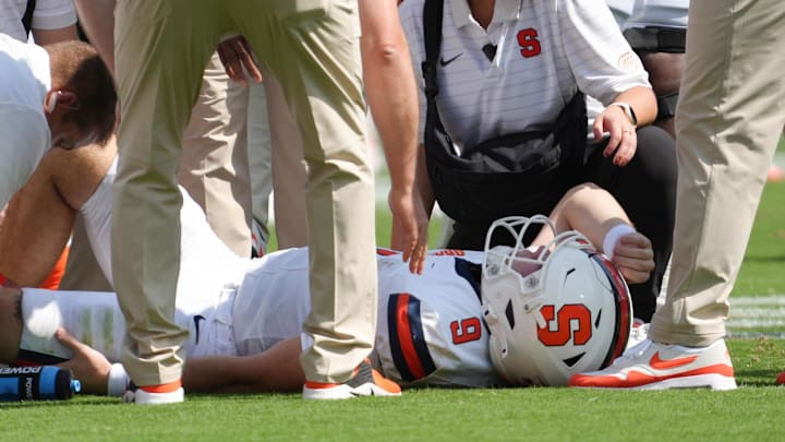 Sep 20, 2025; Clemson, South Carolina, USA; Syracuse Orange quarterback Steve Angeli (9) is checked out after being knocked down by the Clemson Tigers during the first quarter at Memorial Stadium. Mandatory Credit: Ken Ruinard/GREENVILLE NEWS-USA TODAY Network via Imagn Images