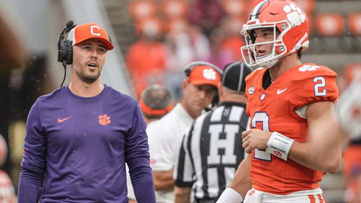 Clemson offensive coordinator Garrett Riley talks with quarterback Cade Klubnik (2) during at timeout in the second quarter at Memorial Stadium in Clemson, S.C. Saturday, September 6, 2025.