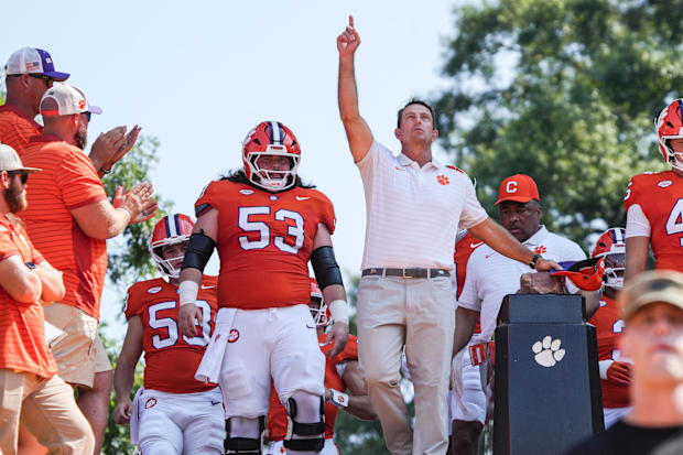 Clemson Tigers head coach Dabo Swinney rubs Howard’s Rock in Memorial Stadium before the game against the Syracuse Orange.