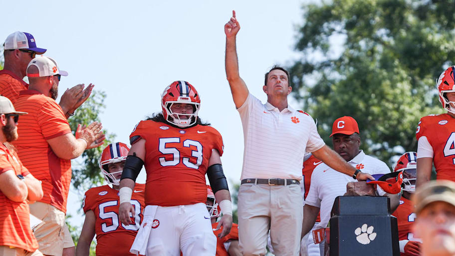 Clemson Tigers head coach Dabo Swinney rubs Howard’s Rock in Memorial Stadium before the game against the Syracuse Orange.