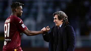 Urbano Cairo (R), chairman of Torino FC, shakes hands with...