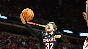 Dec 15, 2024; Ames, Iowa, USA; Nebraska-Omaha Mavericks guard Tony Osburn (32) scores against the Iowa State Cyclones during the second half at James H. Hilton Coliseum. Mandatory Credit: Reese Strickland-Imagn Images