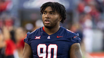 Nov 8, 2025; Tucson, Arizona, USA; Arizona Wildcats defensive lineman Chancellor Owens (90) against the Kansas Jayhawks at Arizona Stadium. Mandatory Credit: Mark J. Rebilas-Imagn Images
