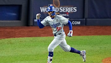 Oct 30, 2024; New York, New York, USA; Los Angeles Dodgers shortstop Mookie Betts (50) celebrates after hitting a sacrifice fly during the eighth inning against the New York Yankees in game four of the 2024 MLB World Series at Yankee Stadium. Mandatory Credit: Brad Penner-Imagn Images