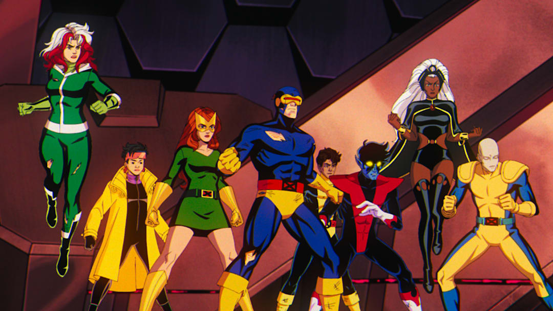 (L-R): Rogue (voiced by Lenore Zann), Jubilee (voiced by Holly Chou), Jean Grey (voiced by Jennifer Hale), Cyclops (voiced by Ray Chase), Roberto Da Costa (voiced by Gui Agustini), Nightcrawler (voiced by Adrian Hough), Storm (voiced by Alison Sealy-Smith), and Morph (voiced by JP Karliak) in Marvel Animation's X-MEN '97. 