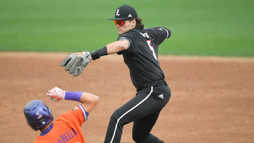 Clemson freshman Cam Cannarella (10) is forced out by Louisville freshman Gavin Kilen (5) during the bottom of the first inning at Doug Kingsmore Stadium in Clemson Friday, May 5, 2023.