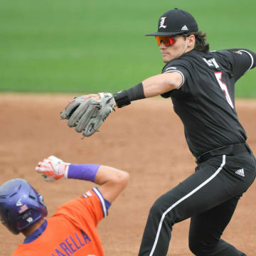 Clemson freshman Cam Cannarella (10) is forced out by Louisville freshman Gavin Kilen (5) during the bottom of the first inning at Doug Kingsmore Stadium in Clemson Friday, May 5, 2023.