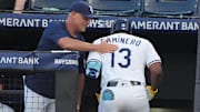 Jun 5, 2025; Tampa, Florida, USA; Tampa Bay Rays third base Junior Caminero (13) is congratulated by manager Kevin Cash after hitting a home run against the Texas Rangers in the second inning at George M. Steinbrenner Field. 