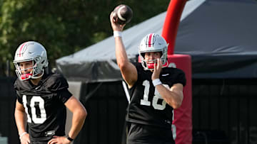 Aug 8, 2024; Columbus, Ohio, USA; Ohio State Buckeyes quarterback Will Howard (18) throws beside quarterback Julian Sayin (10) during football practice at the Woody Hayes Athletic Complex.
